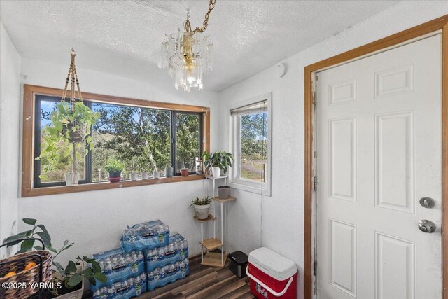 101 W Slavin Rd, Yakima, WA 98903 - sitting room featuring wood finished floors, a textured ceiling, and a chandelier