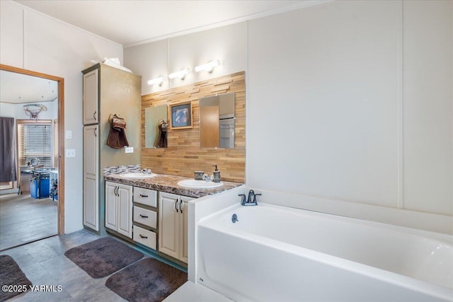 bathroom with a garden tub, double vanity, wood walls, and a sink