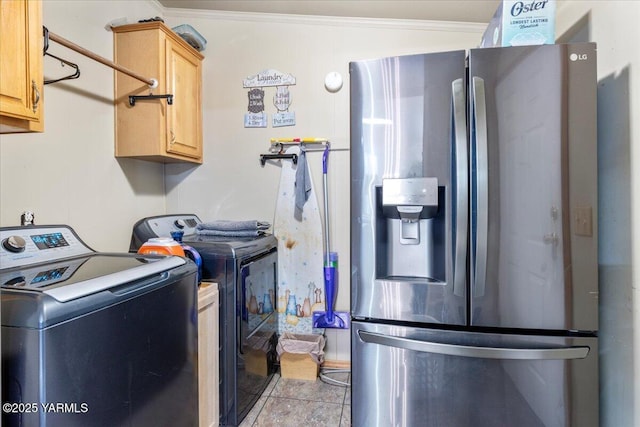 washroom with laundry area, light tile patterned flooring, crown molding, and washer and clothes dryer