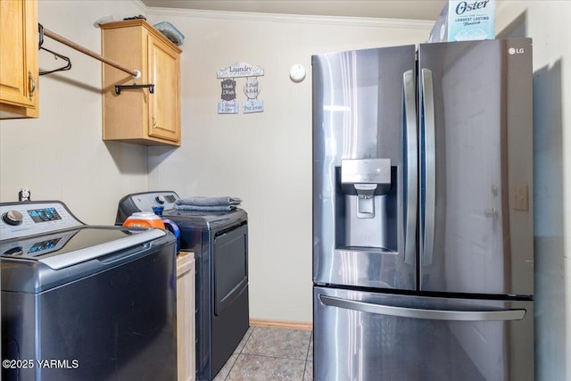 interior space with laundry area, ornamental molding, and washer and clothes dryer