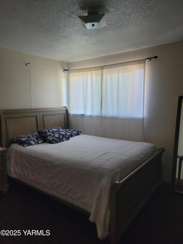 bedroom featuring a textured ceiling