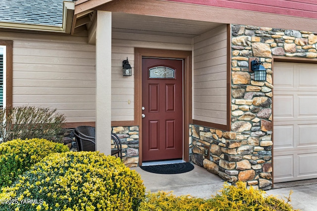 property entrance with stone siding