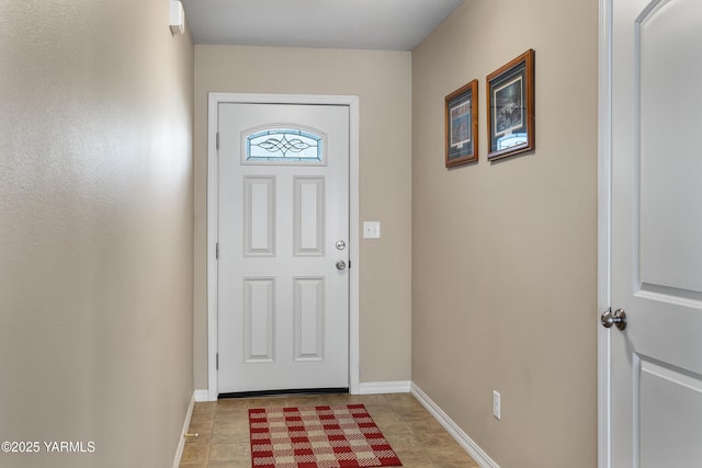 entryway featuring baseboards