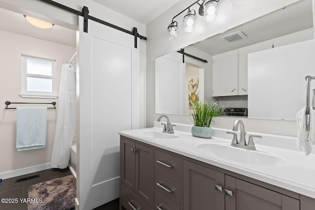 419 N 62nd Ave, Yakima, WA 98908 - bathroom with visible vents, a sink, and double vanity