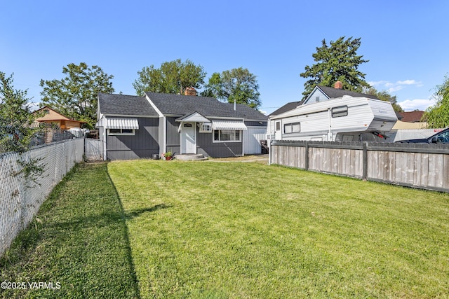 1523 Roosevelt Ave, Yakima, WA 98902 - back of property with entry steps and a chimney