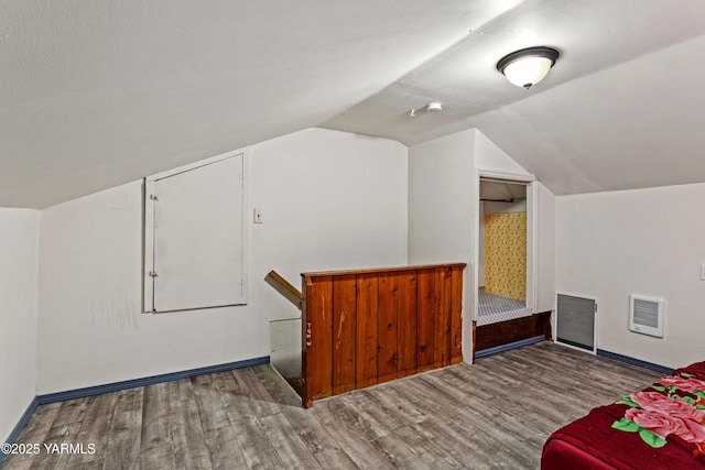 1523 Roosevelt Ave, Yakima, WA 98902 - additional living space with wood finished floors, vaulted ceiling, baseboards, and heating unit