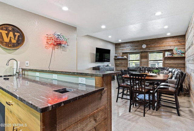 kitchen featuring a sink, recessed lighting, and open floor plan