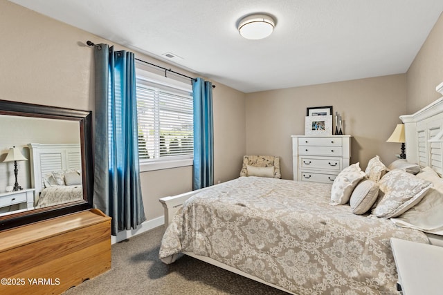 carpeted bedroom with baseboards and visible vents