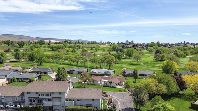 aerial view featuring a residential view, a mountain view, and golf course view