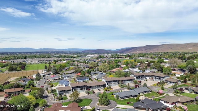 birds eye view of property featuring a mountain view and a residential view