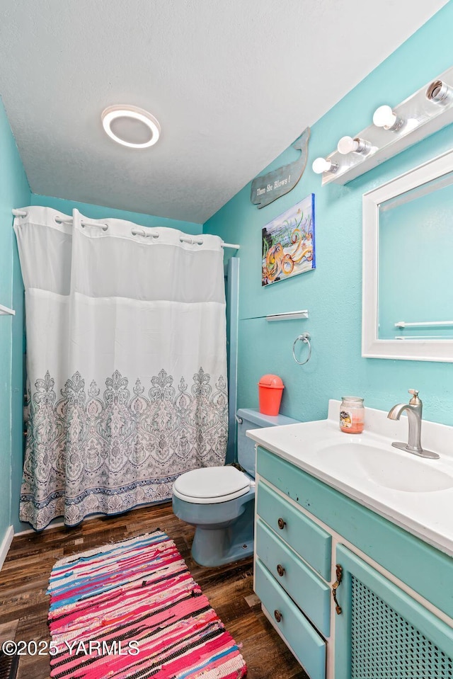 1620 Selah Loop Rd, Selah, WA 98942 - full bath featuring vanity, wood finished floors, and a shower with curtain