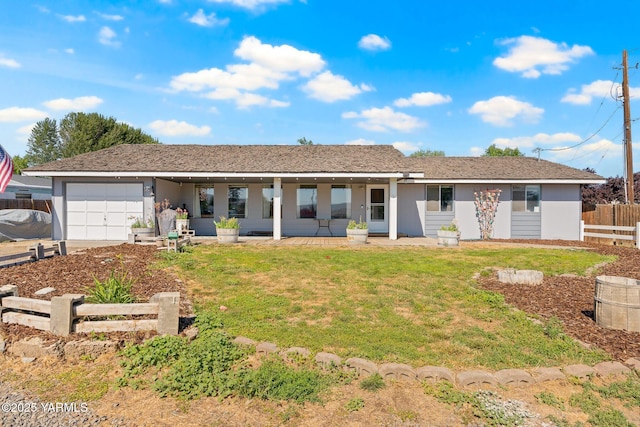 1620 Selah Loop Rd, Selah, WA 98942 - back of property featuring an attached garage, stucco siding, and driveway