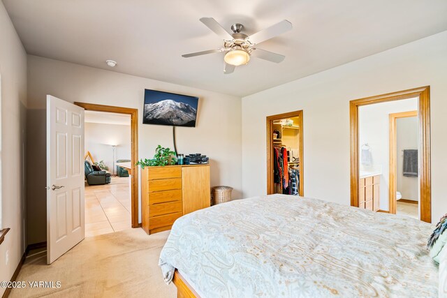 9307 Torrey Pines Ln, Yakima, WA 98908 - bedroom featuring a walk in closet, light carpet, a ceiling fan, and a closet