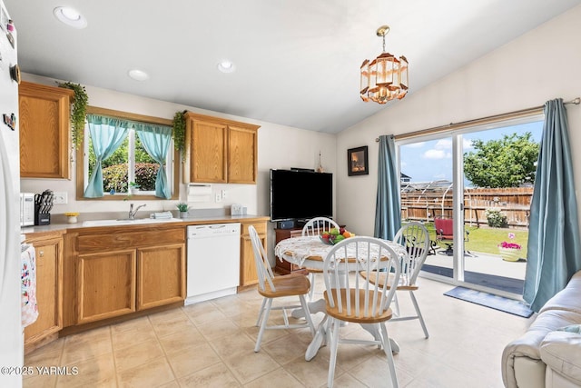 101 Darland Ave, Moxee, WA 98936 - kitchen with white dishwasher, vaulted ceiling, light countertops, recessed lighting, and hanging light fixtures