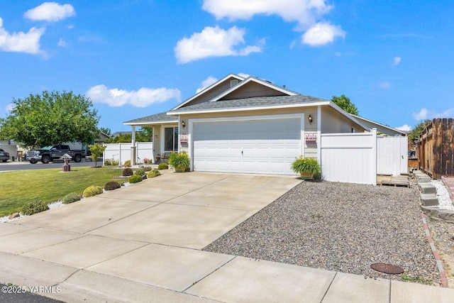 101 Darland Ave, Moxee, WA 98936 - ranch-style house with concrete driveway, an attached garage, and roof with shingles