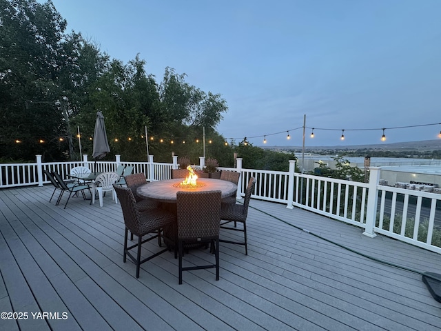 1391 Lancaster Rd, Selah, WA 98942 - wooden terrace featuring outdoor dining area and a fire pit