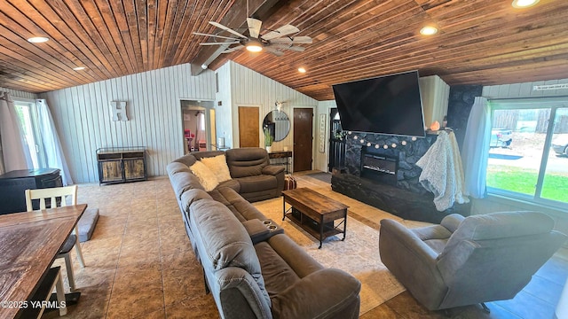 1391 Lancaster Rd, Selah, WA 98942 - living area featuring wooden ceiling, vaulted ceiling, a tiled fireplace, and a ceiling fan