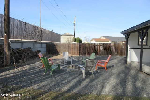 exterior space with a patio, an outdoor fire pit, and a fenced backyard