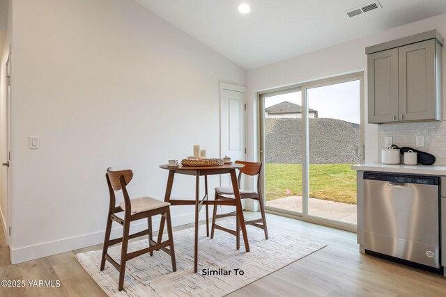 703 Vineyard Street (Phase 2Lot 21) Spec, Grandview, WA 98930 - dining space with vaulted ceiling, light wood finished floors, baseboards, and recessed lighting