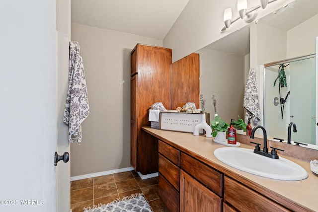 bathroom featuring tile patterned floors, vanity, and baseboards