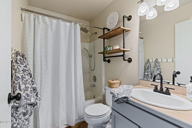 full bath with vanity, toilet, and shower / tub combo with curtain