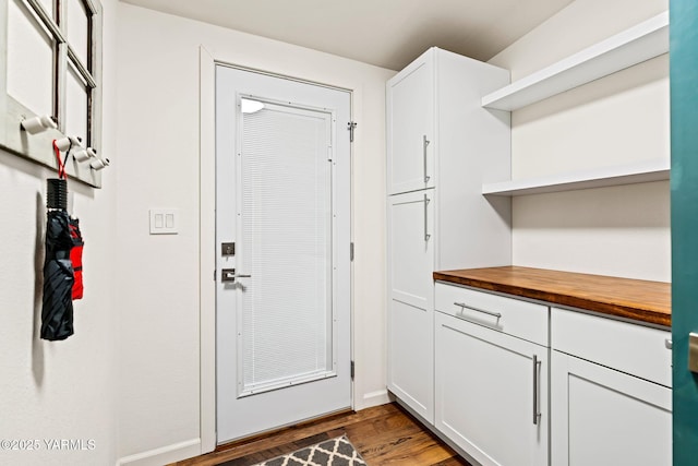 5709 Marilane St, Yakima, WA 98908 - doorway to outside featuring dark wood finished floors and baseboards