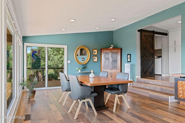 5709 Marilane St, Yakima, WA 98908 - dining area featuring a barn door, wood finished floors, lofted ceiling, recessed lighting, and washer / dryer