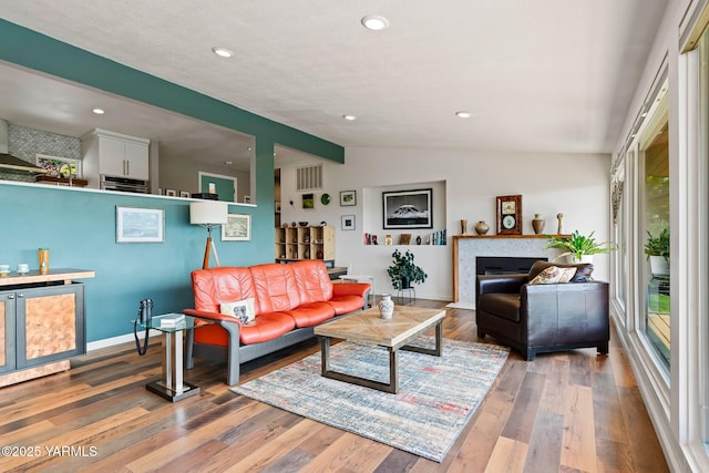 5709 Marilane St, Yakima, WA 98908 - living room with lofted ceiling, wood finished floors, recessed lighting, and a fireplace
