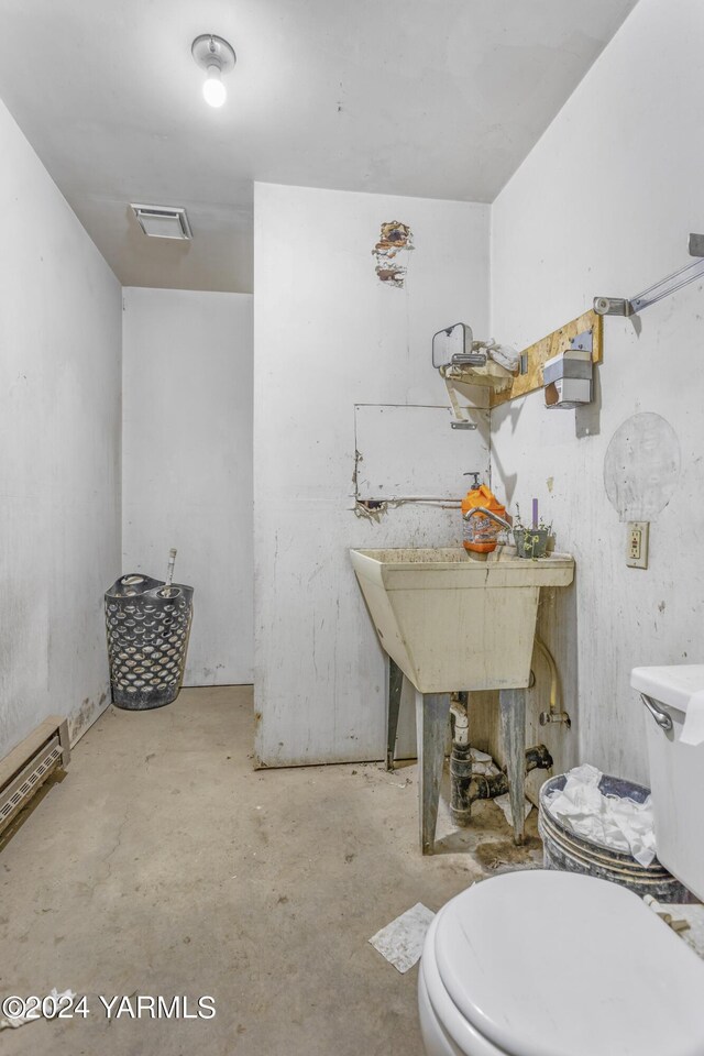 bathroom with visible vents, unfinished concrete flooring, and toilet