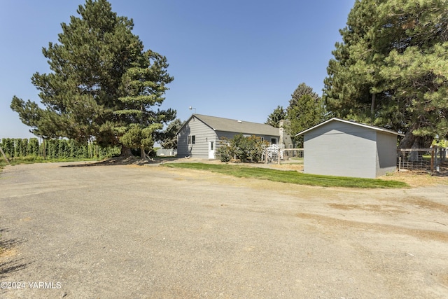 view of side of property featuring fence