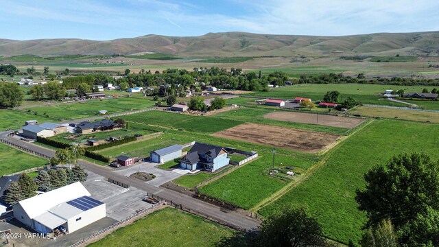 drone / aerial view featuring a mountain view and a rural view