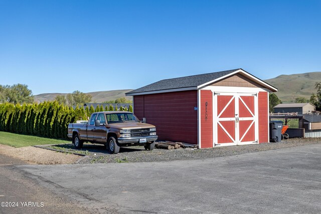 view of shed featuring a mountain view