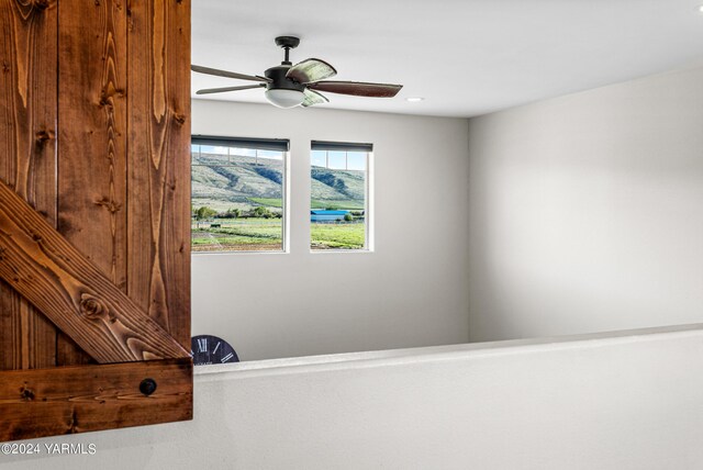 interior details with a ceiling fan