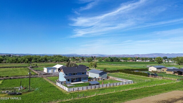 bird's eye view with a mountain view and a rural view