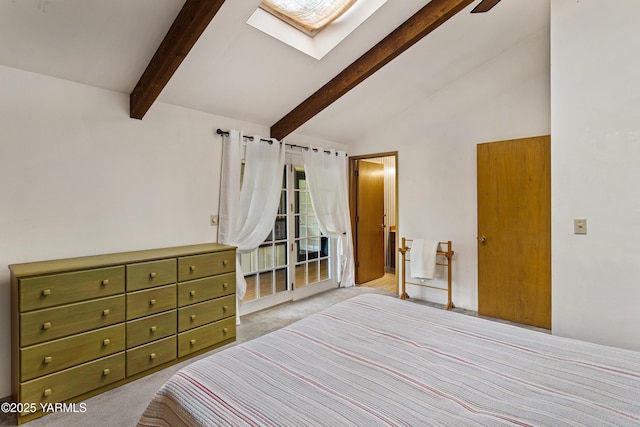 bedroom featuring light carpet and lofted ceiling with skylight