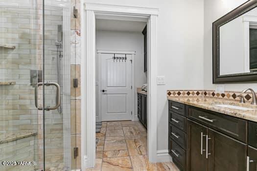921 Tibbling Rd, Selah, WA 98942 - bathroom featuring vanity, a stall shower, and baseboards