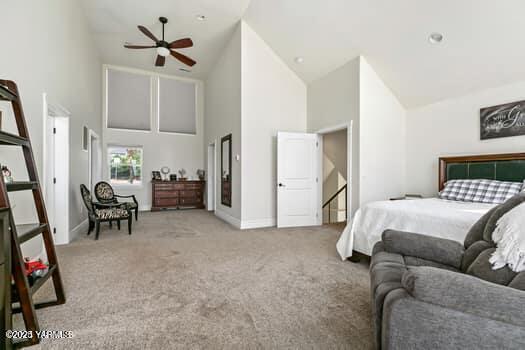 921 Tibbling Rd, Selah, WA 98942 - bedroom with high vaulted ceiling, carpet, and baseboards