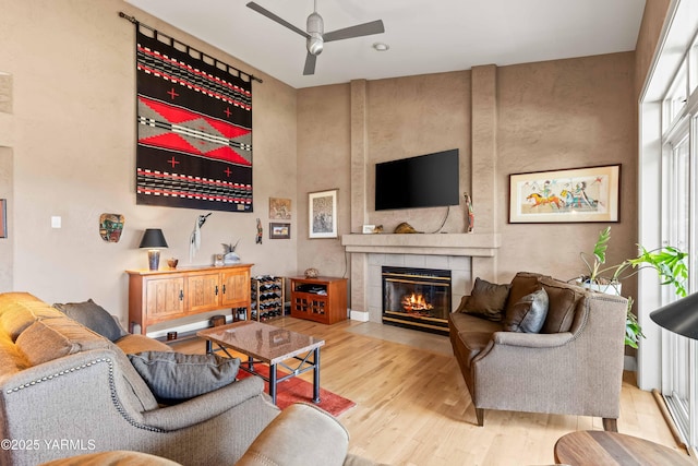 131 Katie Ln, Selah, WA 98942 - living area featuring wood finished floors, a ceiling fan, and a tile fireplace