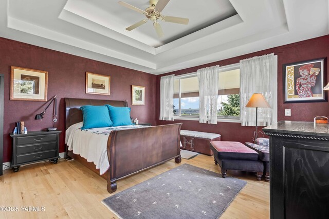 131 Katie Ln, Selah, WA 98942 - bedroom featuring a raised ceiling, wood finished floors, and ceiling fan