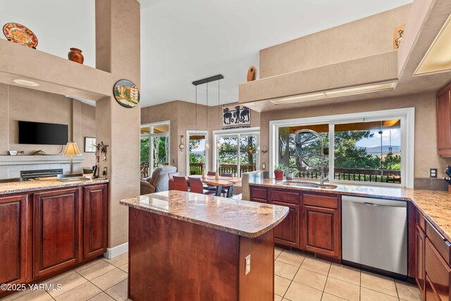 131 Katie Ln, Selah, WA 98942 - kitchen featuring stainless steel dishwasher, light tile patterned flooring, light stone counters, and a sink
