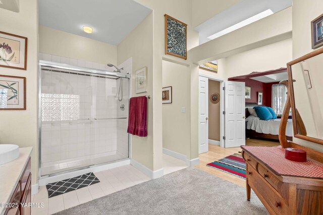 131 Katie Ln, Selah, WA 98942 - bathroom featuring a stall shower, ensuite bath, vanity, and baseboards