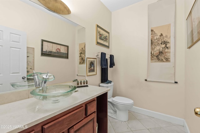131 Katie Ln, Selah, WA 98942 - bathroom with vanity, tile patterned flooring, toilet, and baseboards