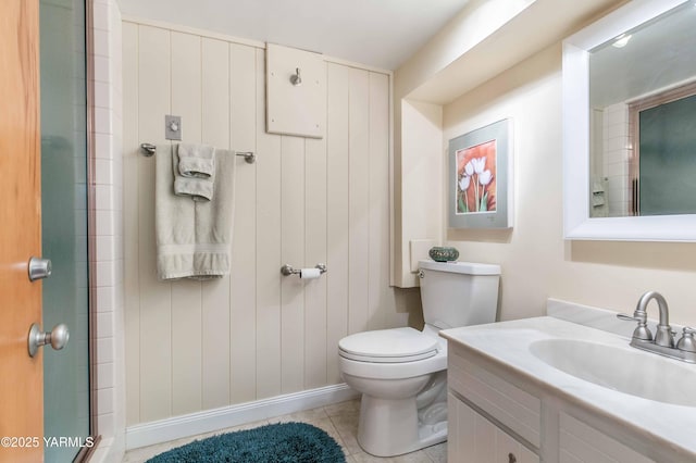 full bath with tile patterned flooring, vanity, toilet, baseboards, and an enclosed shower