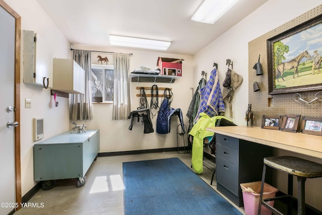 interior space with baseboards and heating unit