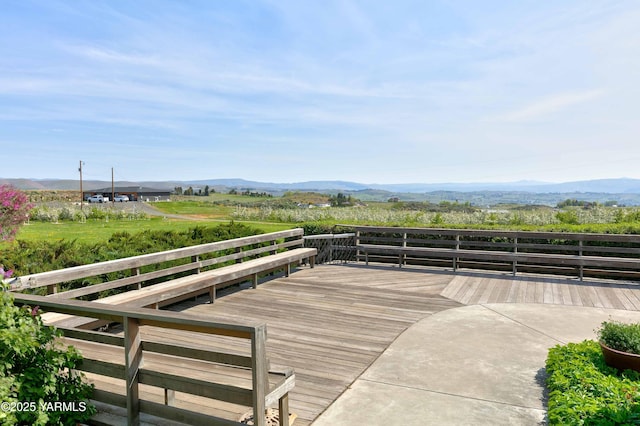 wooden deck featuring a mountain view
