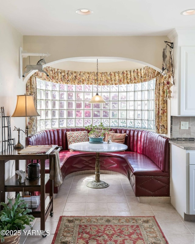 sitting room with light tile patterned floors, recessed lighting, and a wealth of natural light