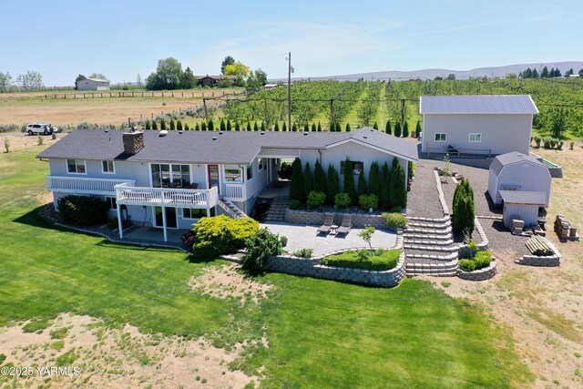 15911 Fisk Rd, Yakima, WA 98908 - back of property featuring stairs, a deck with mountain view, and a yard