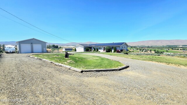 15911 Fisk Rd, Yakima, WA 98908 - ranch-style house featuring a garage, a mountain view, a front lawn, and an outdoor structure
