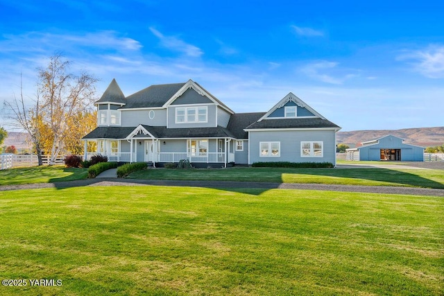 view of front facade featuring a front lawn and a porch