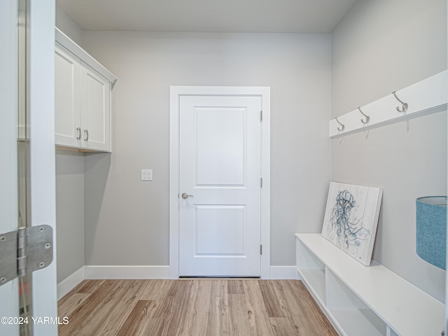 mudroom featuring light wood-type flooring and baseboards